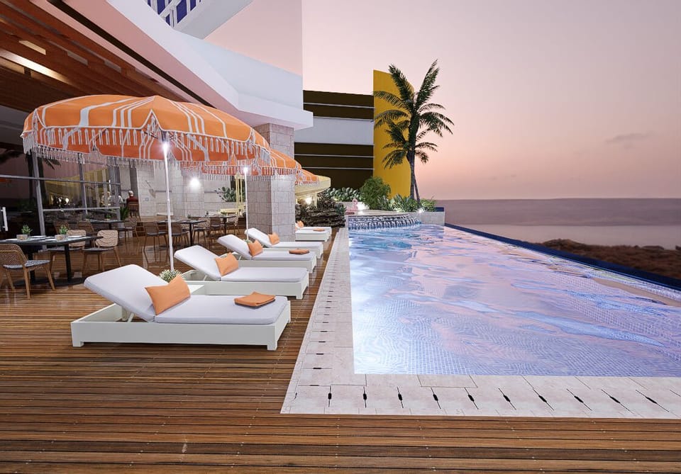 2 outdoor pools, open 6:00 AM to 8:00 PM, lifeguards on site