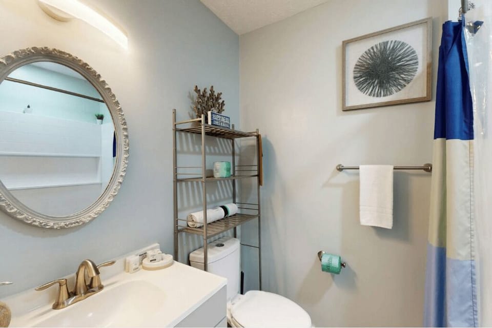 main floor full bath with tub and shower