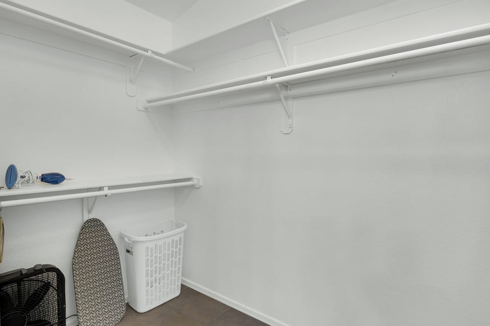 Walk-in Closet w/ Hangers, Box Fan, Iron, Ironing Board & Extra Linens. 