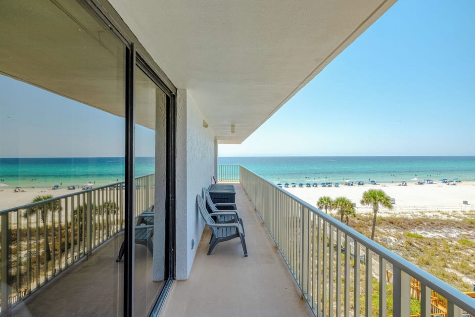 Wrap balcony accessible from two master bedrooms
