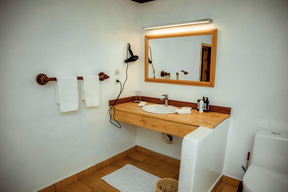 Shower, free toiletries, hair dryer, slippers