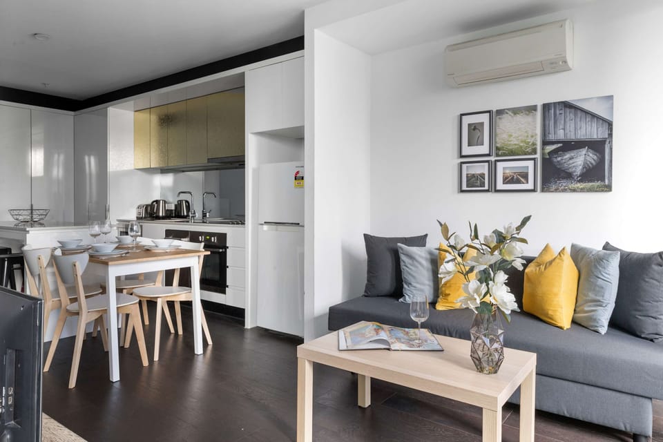 A cozy living area with a 3-seater sofa bed that folds out to a double.