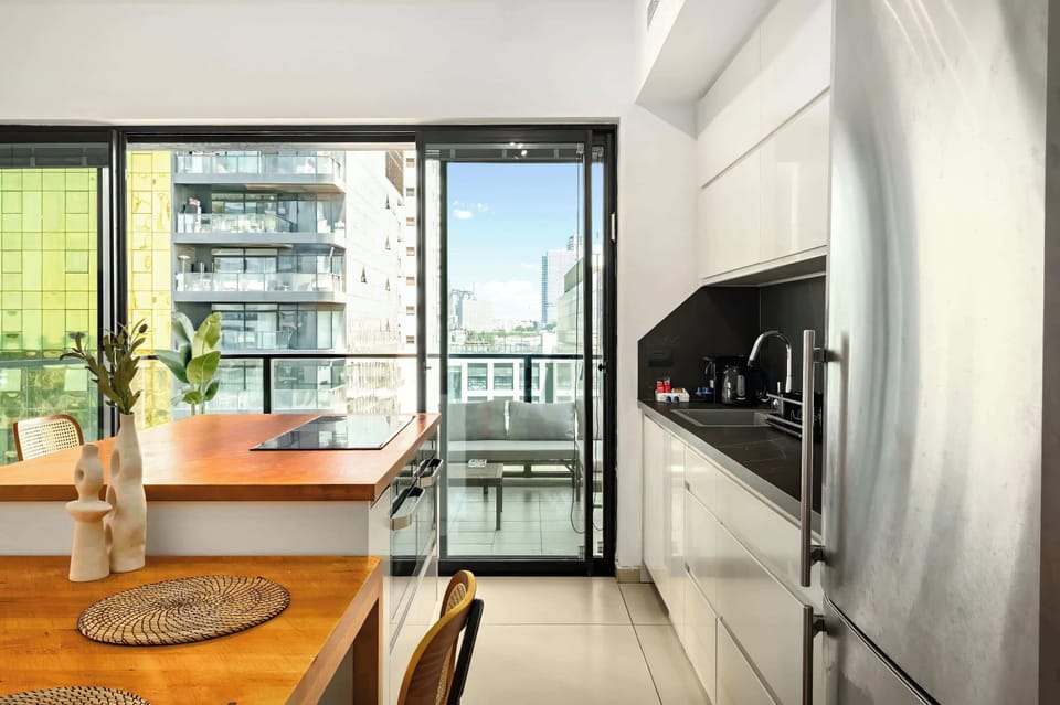 From kitchen to terrace, the apartment feels open, bright, and wonderfully easy to enjoy together.
