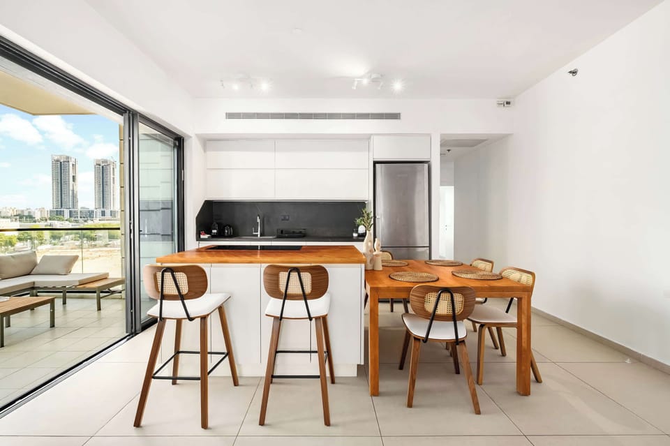 Open kitchen and dining area make meals easy, with balcony access extending every gathering beautifully.