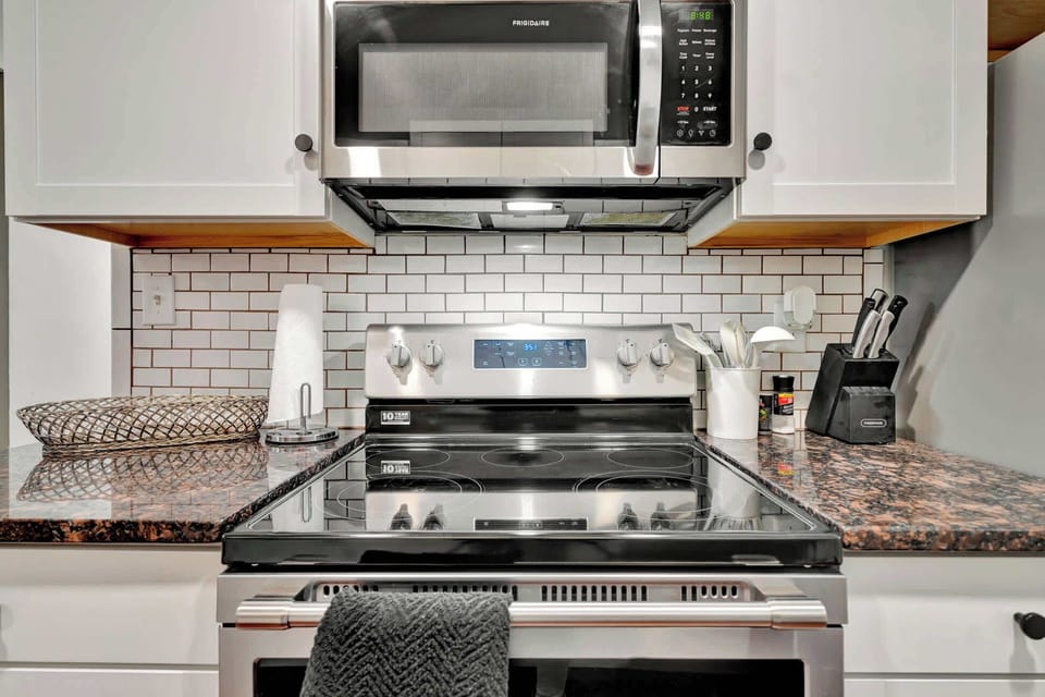 Our sleek kitchen fully equipped with modern appliances for your culinary needs!