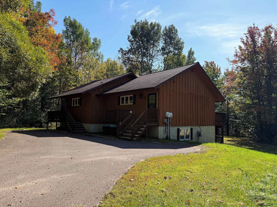 Frosthaven. Unit two is on the right side. Both units share a paved driveway with parking spaces for 2 vehicles, depending on size. 