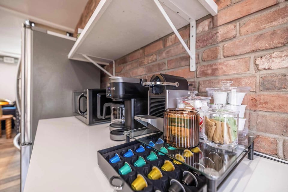 Your morning just got better ☕ Our Pitt Vibes kitchen is fully stocked with a premium coffee & espresso bar — complete with pods, sweeteners, and all the fixings to start your day right.