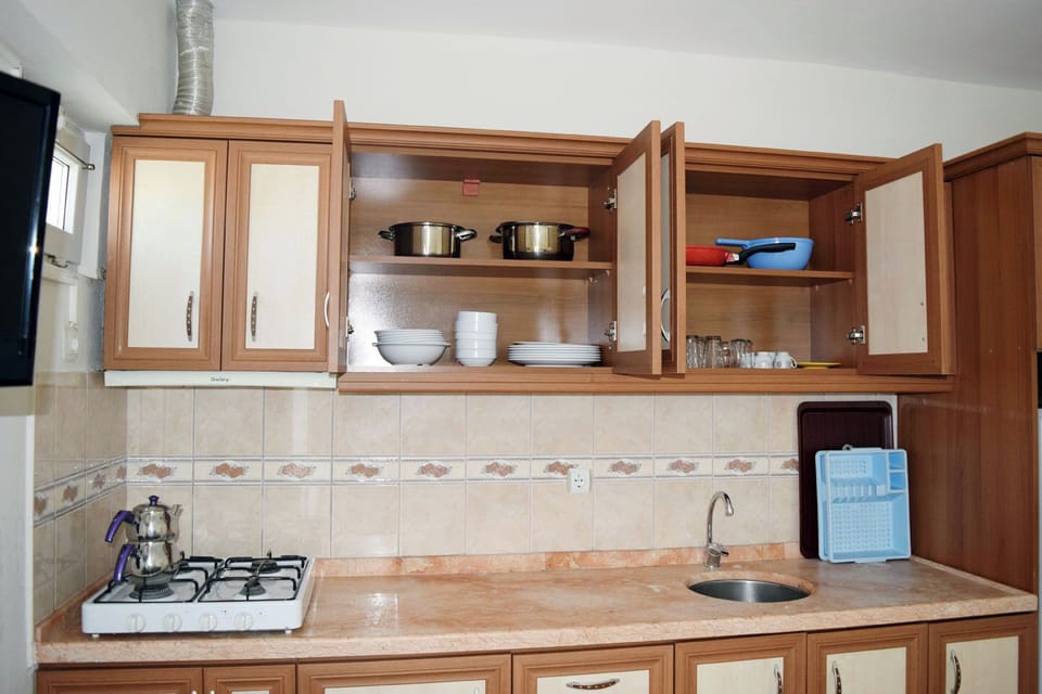 Classic Apartment, Balcony | Private kitchen | Fridge, cookware/dishes/utensils
