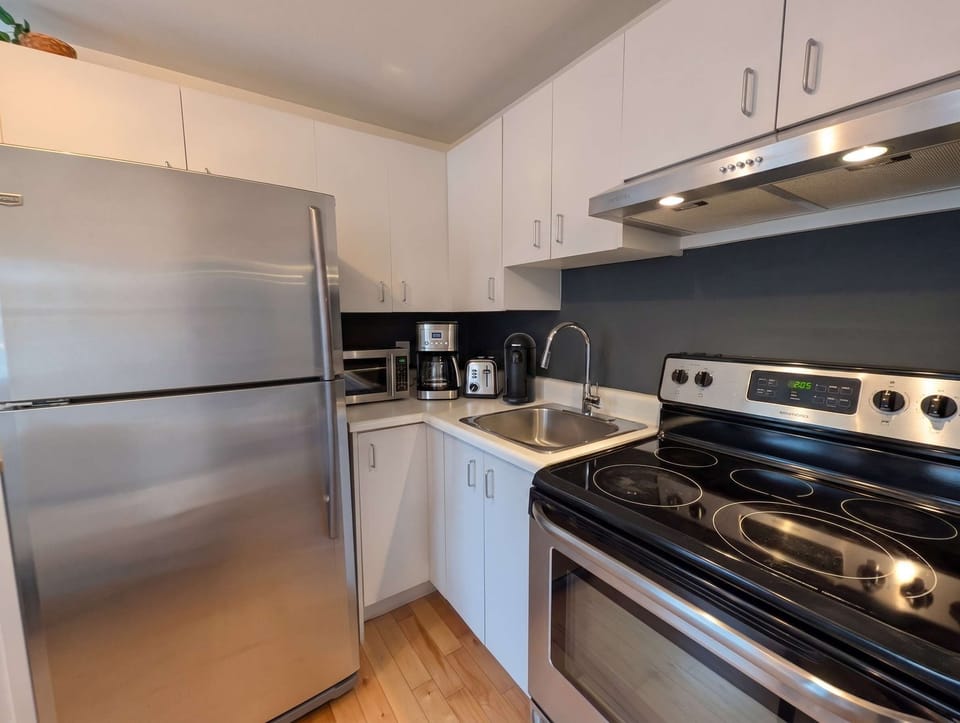 Cuisine entièrement équipée pour préparer vos repas en toute simplicité, comme à la maison, au cœur de Québec !