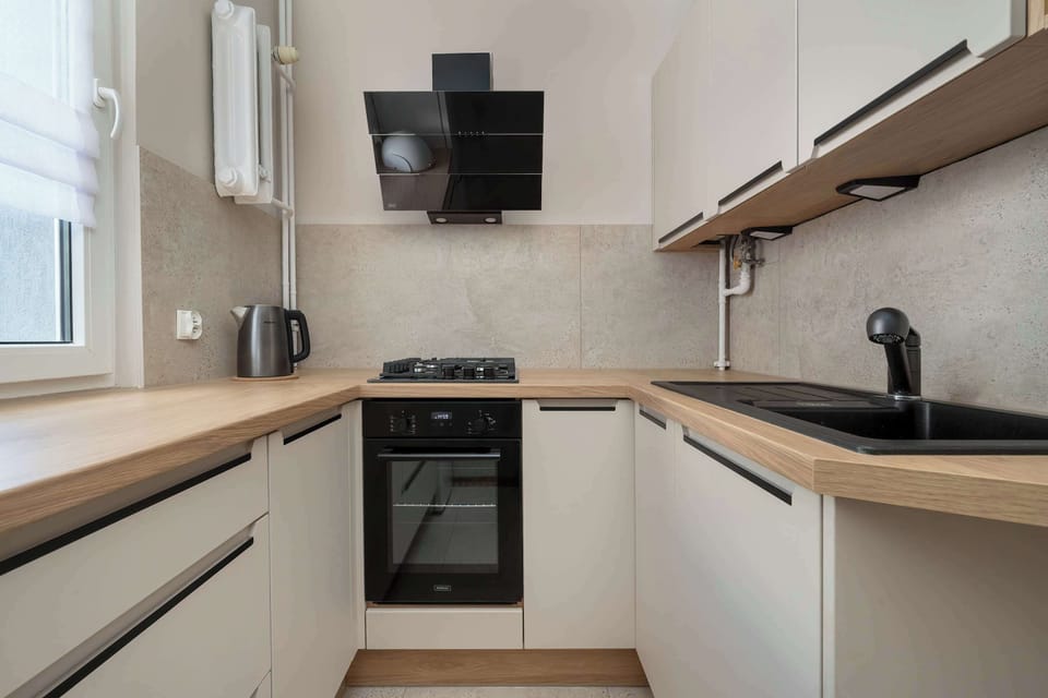 The kitchen offers a functional layout for convenient cooking.