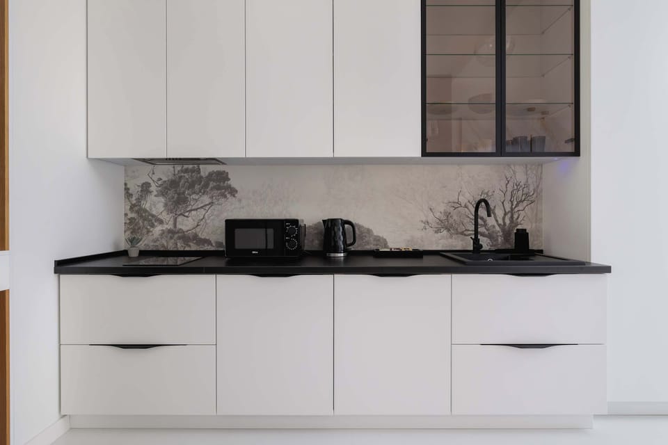 Spacious kitchenette with built-in appliances and stylish finishes.