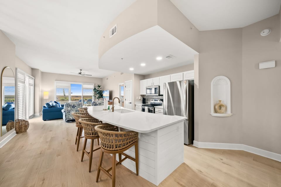 The recently renovated, fully equipped kitchen features quartz countertops, stainless-steel appliances, and has everything you need to prepare meals for family & friends.