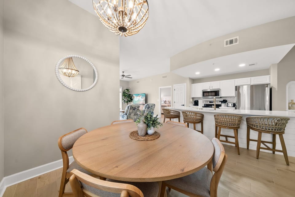 There is a brand-new dining table, perfect for enjoying a meal or playing a game, as well as additional breakfast bar seating.