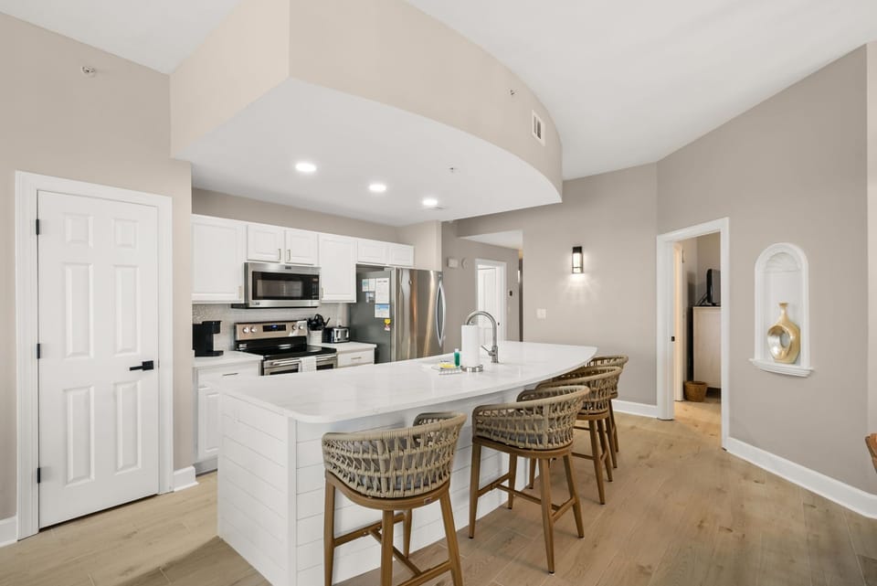 The recently renovated, fully equipped kitchen features quartz countertops, stainless-steel appliances, and has everything you need to prepare meals for family & friends.