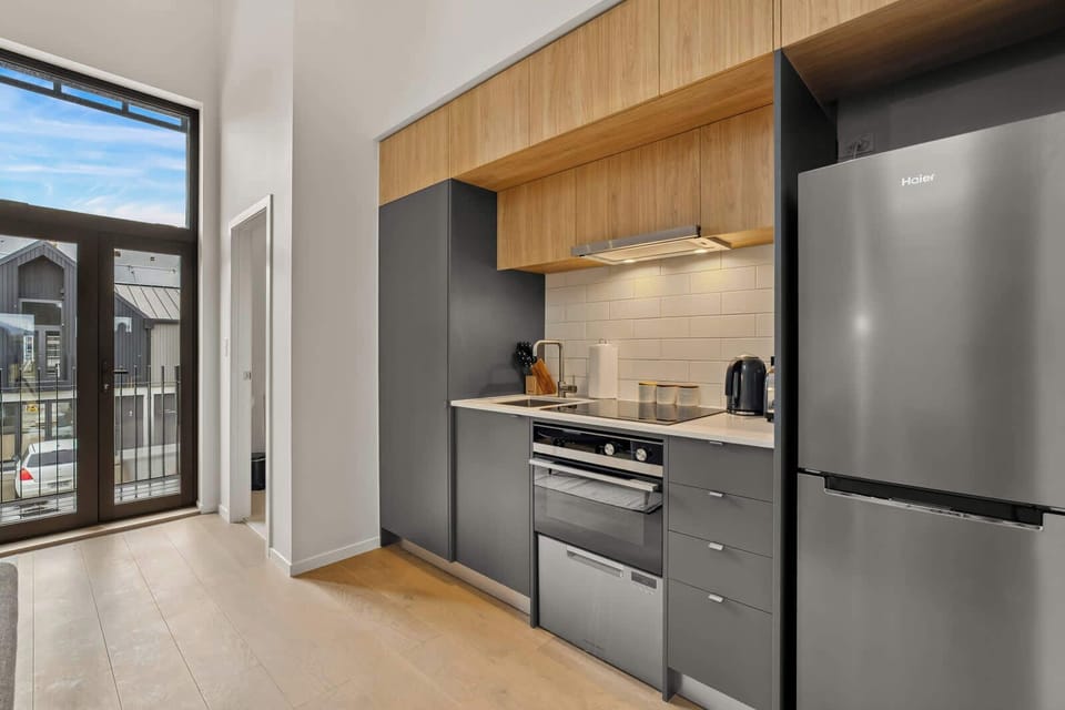 Modern kitchen with sleek appliances and ample storage