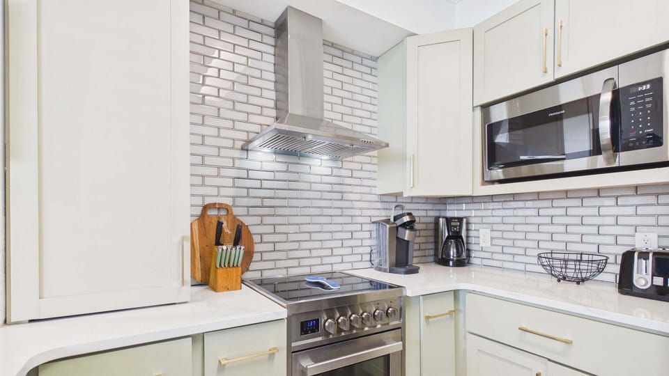 Fully applianced kitchen with coffee and other cooking essentials