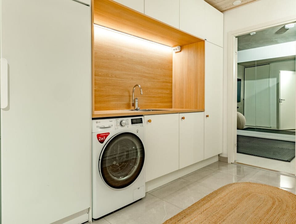 Perfect for longer stays! Our villa includes a modern washing machine and a convenient utility sink.