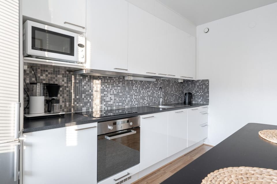 Bright and airy kitchen featuring all the essentials for a home-cooked meal.