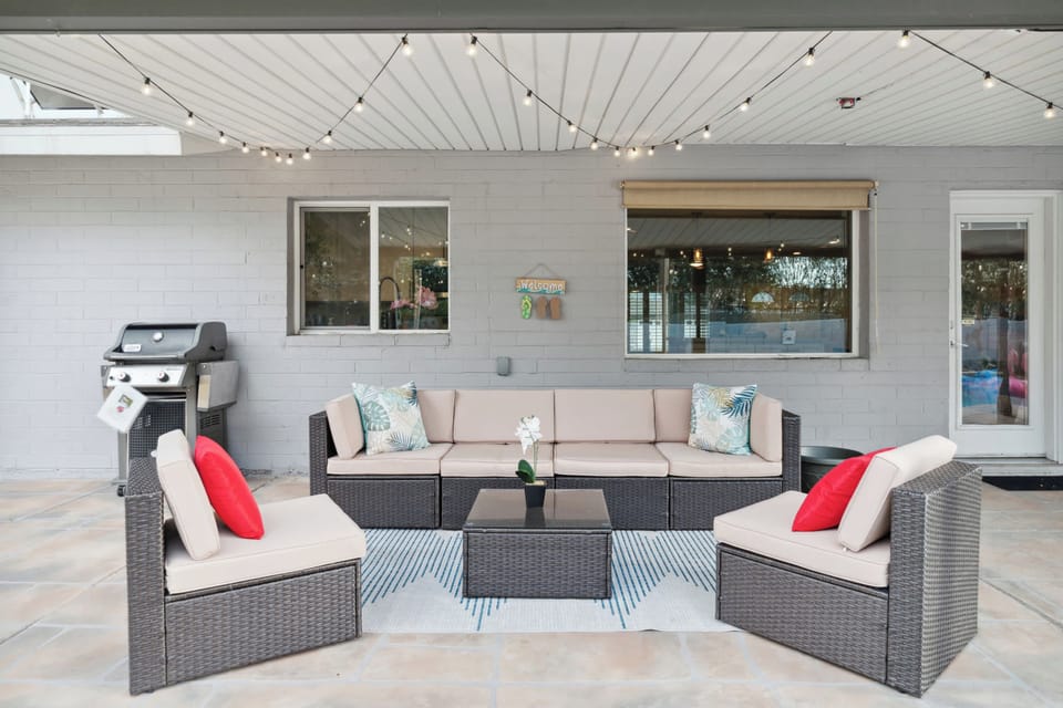 Unwind in this inviting outdoor lounge with cozy seating, stylish décor, and a BBQ—perfect for relaxing or entertaining.