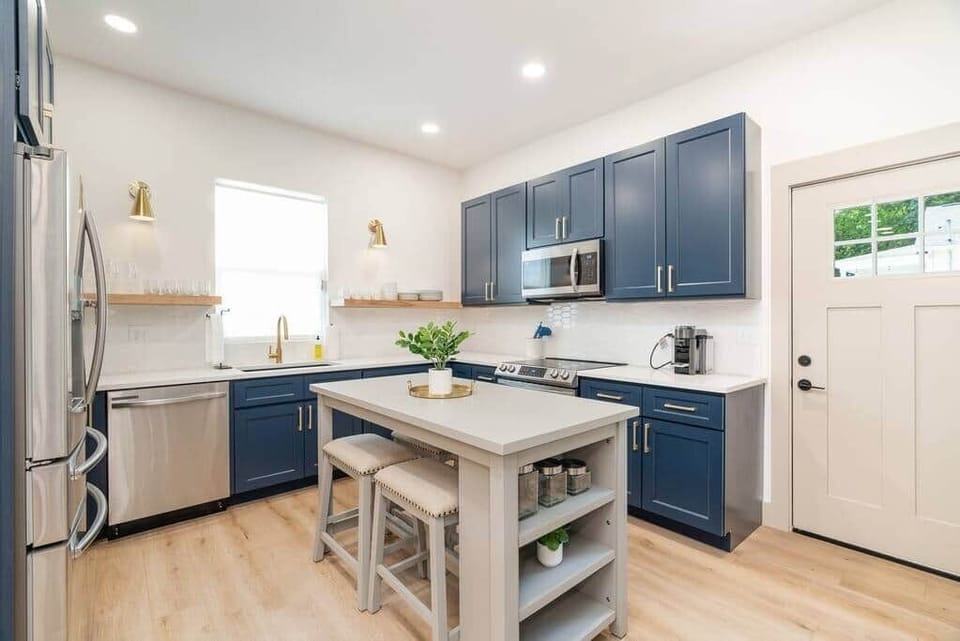 Eat in kitchen with high end appliances. Island with 4 seats and large sink.