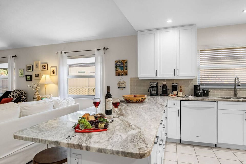 Beautiful countertops with bar seating to chat with the chef