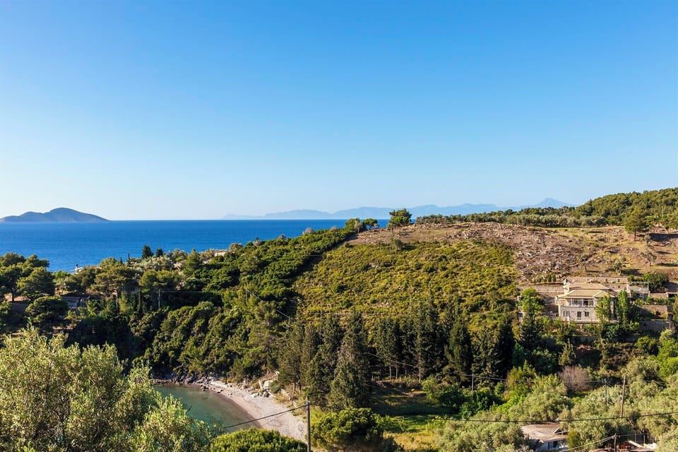 The stunning location of Hibiscus perched above a sandy bay.