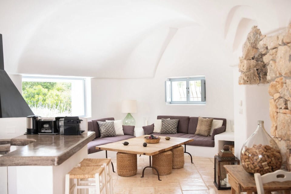 Looking from the dining area towards the kitchen and living area.
