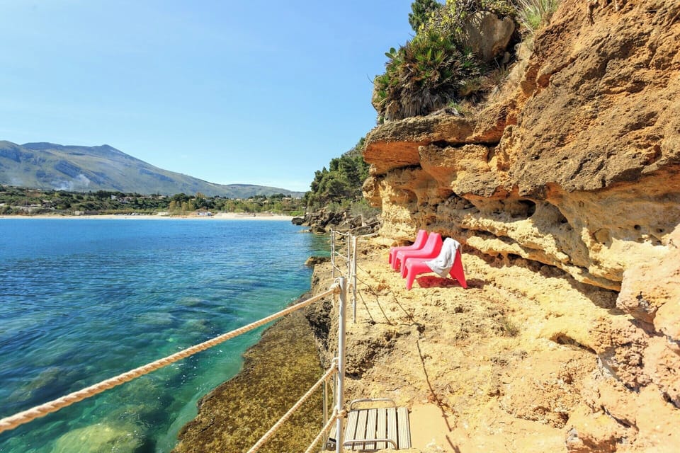 A removable ladder provides access to a semi-submerged bathing platform.