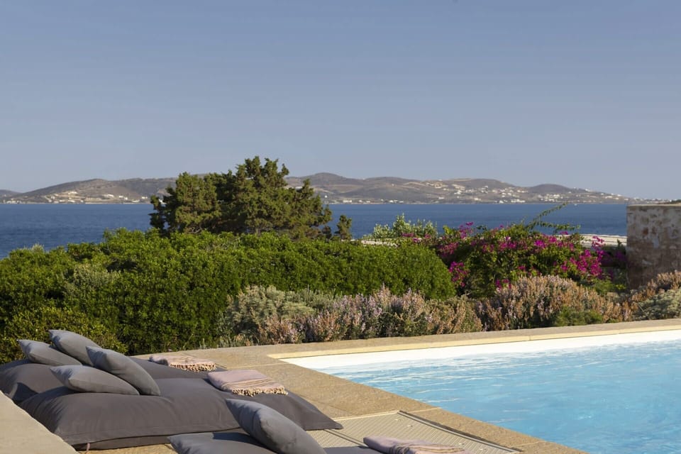 Comfortable poolside lounging and views out to sea.