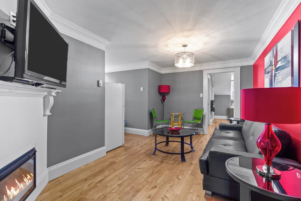 Stylish grey living room with comfortable seating, a coffee table, and modern decor.