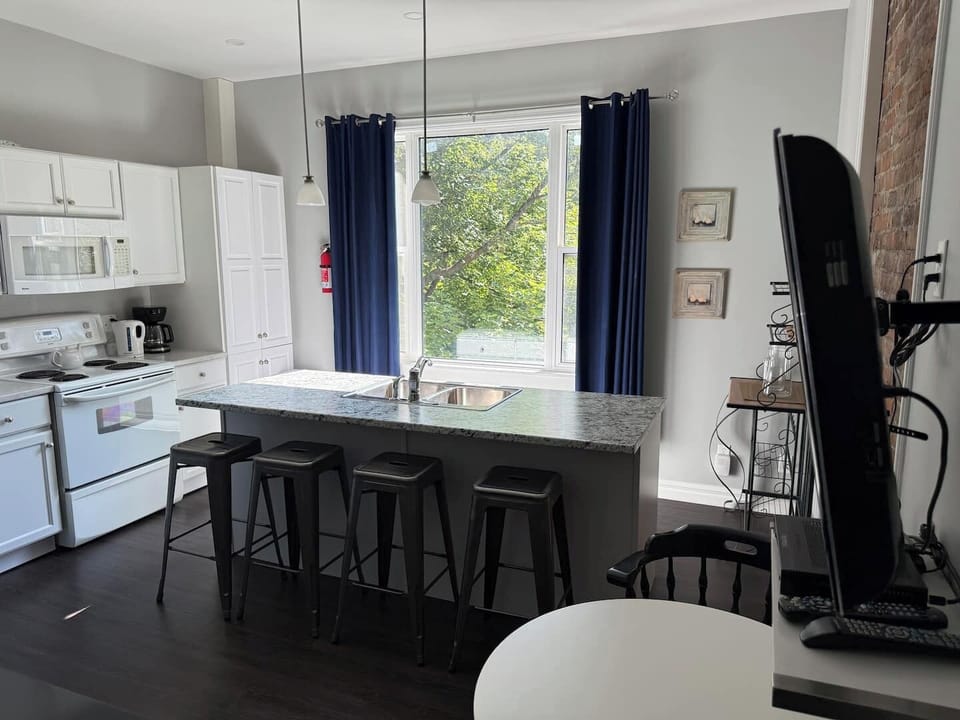 Savor delicious meals and lively conversations in our inviting kitchen and dining area.