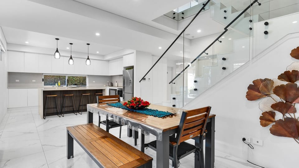 Seamless flow between kitchen and dining.