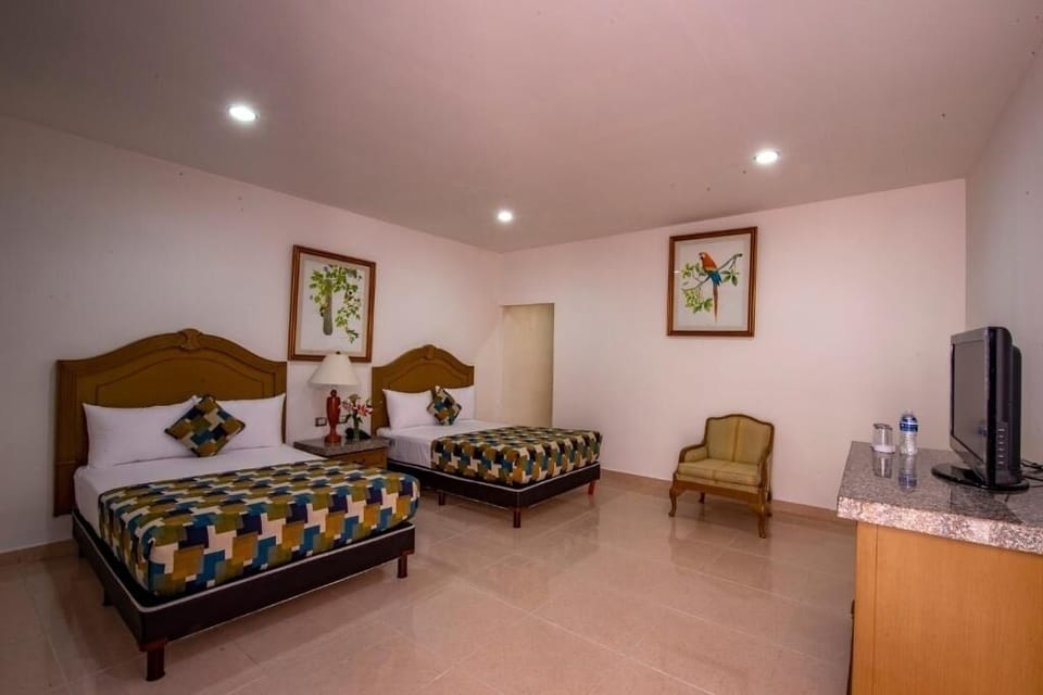 Stretch out in spacious room with TV and cozy chair.