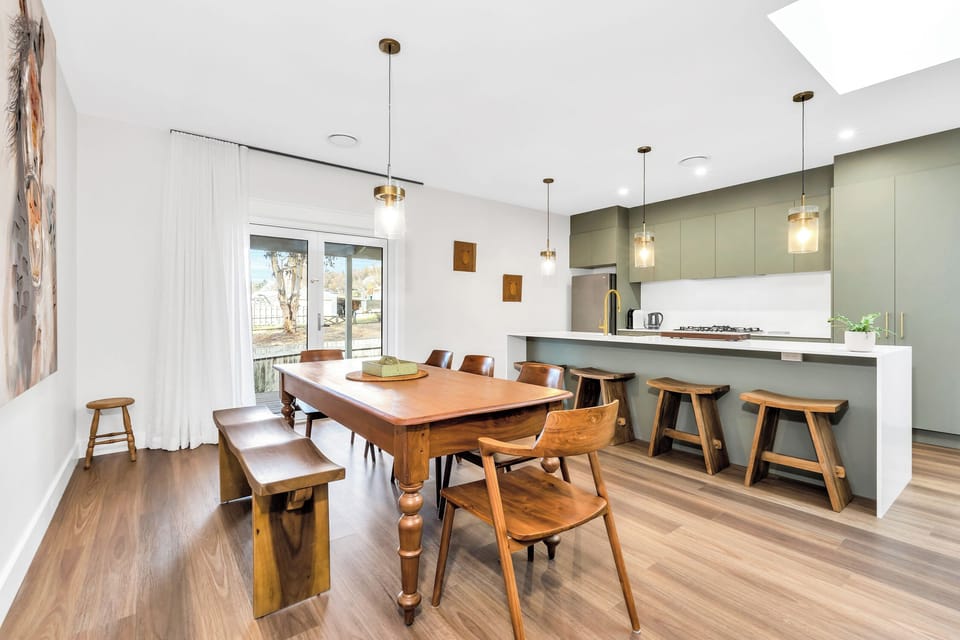 dining/kitchen area with double French doors leading to wrap around verandah