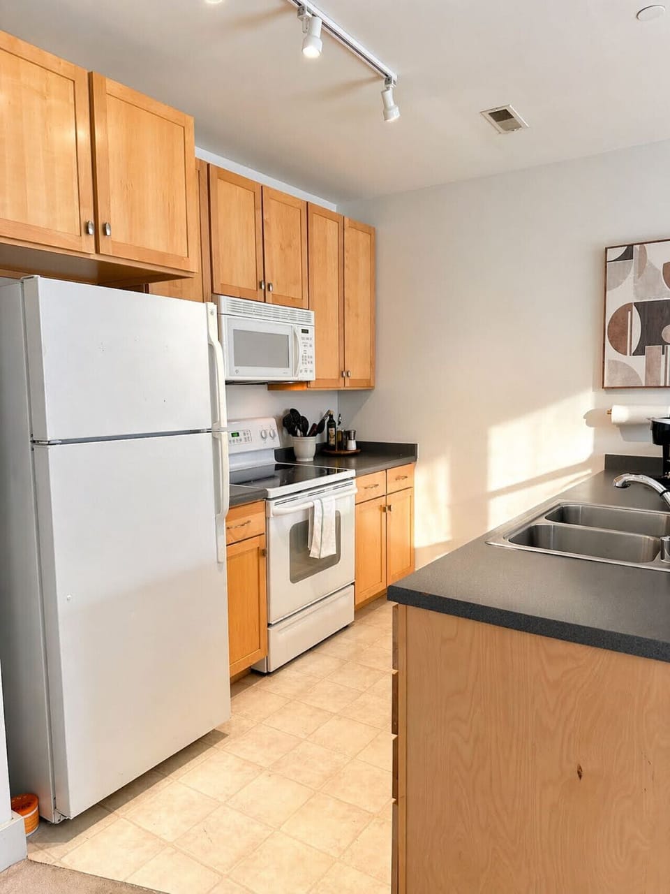 A fully-equipped kitchen with a breakfast bar for casual dining—everything you need to prep, cook, and refuel