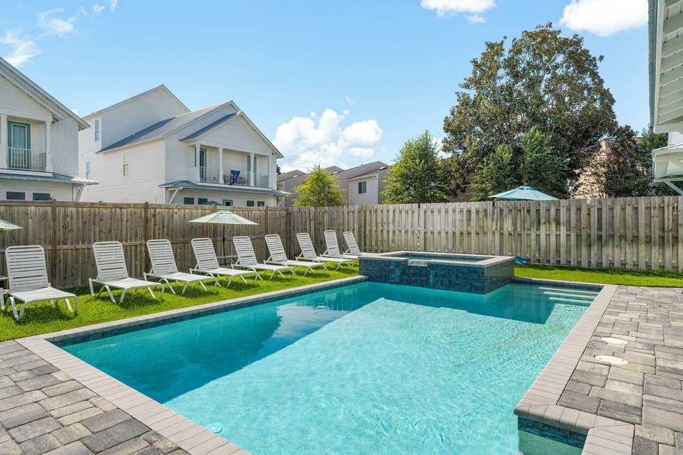 Pool area with spa and gas grill