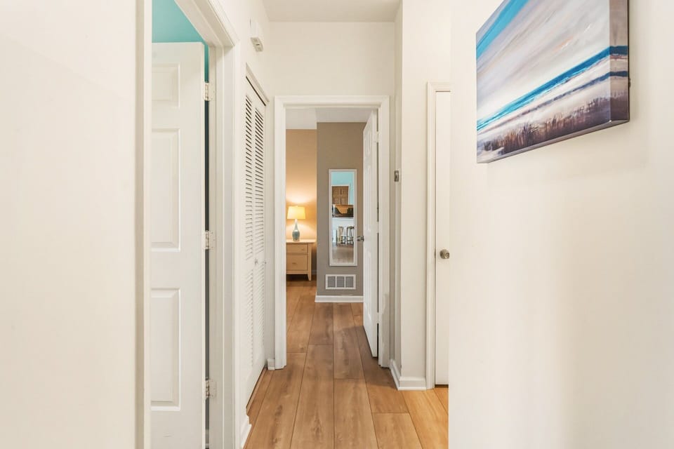 Hallway: Bright hallway connecting bedrooms and bathrooms, with easy access to all main living spaces.