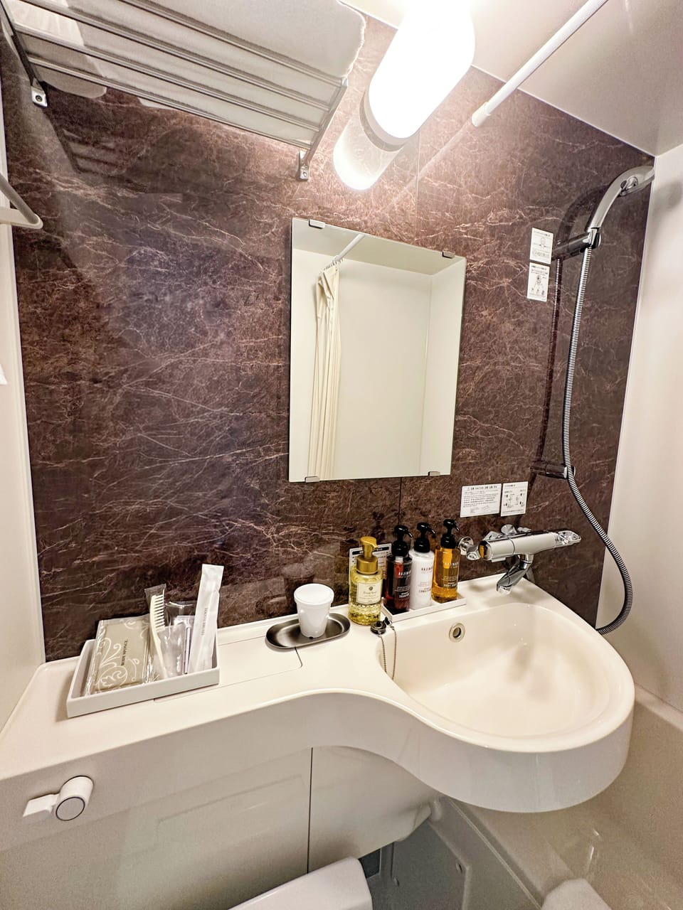 Combined shower/tub, hair dryer, slippers, towels