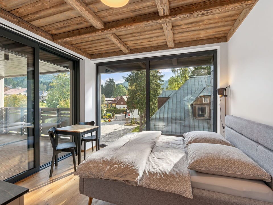 Wood, Furniture, Hardwood, Bedroom, Chair, Natural Material, Bed, Wood Stain, Bedding, Eco Hotel