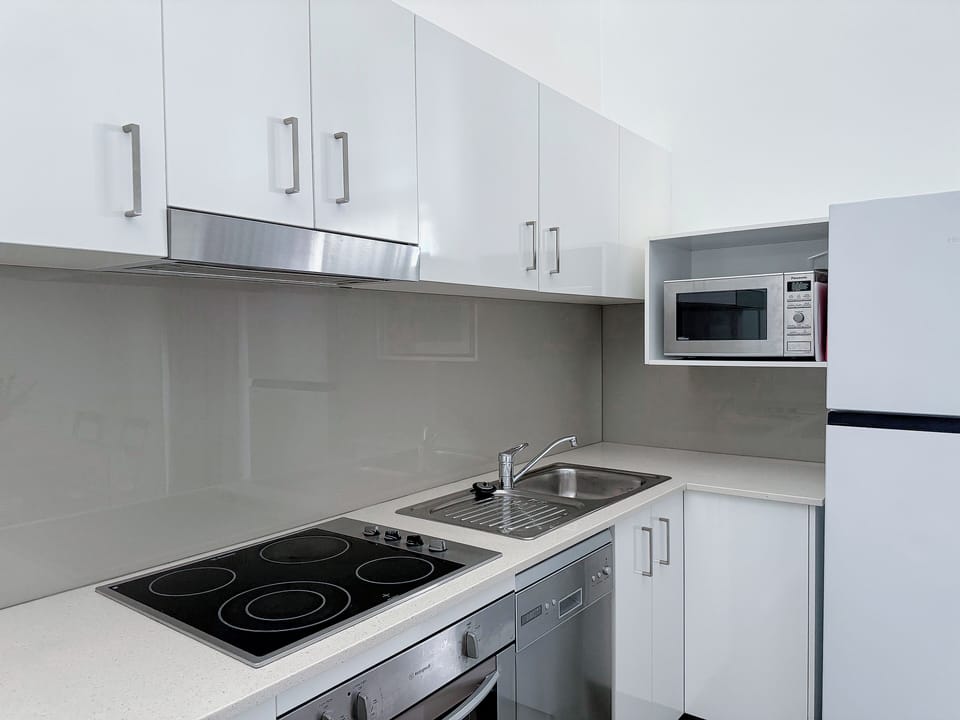 Comfort Apartment, 1 Queen Bed, Non Smoking | Private kitchen | Full-size fridge, microwave, oven, stovetop