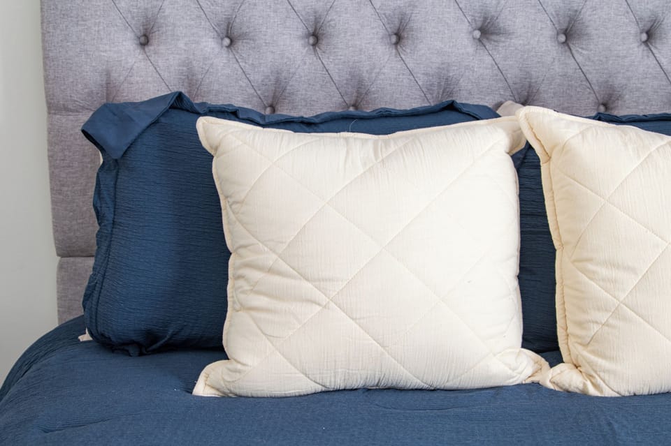 Plush pillows and soft textures create a restful and cozy sleep experience.