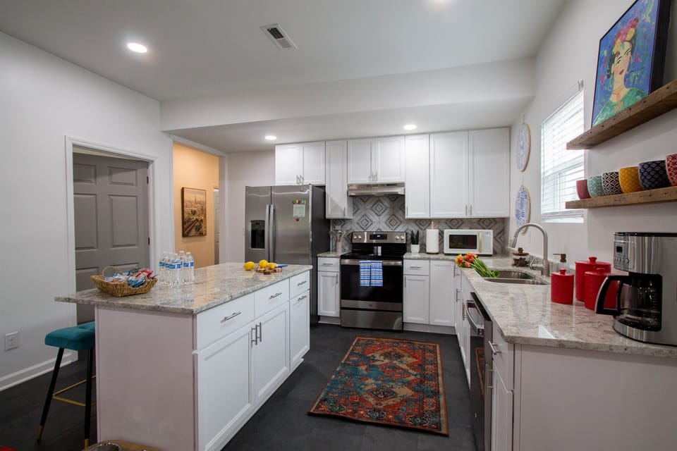 Full  kitchen with stainless steel appliances.