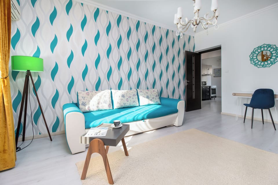 Exclusive Apartment, Balcony, City View | Living area | 108-cm Smart TV with cable channels