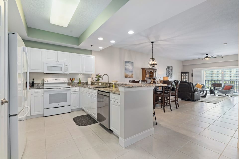 Kitchen with dining table in background
