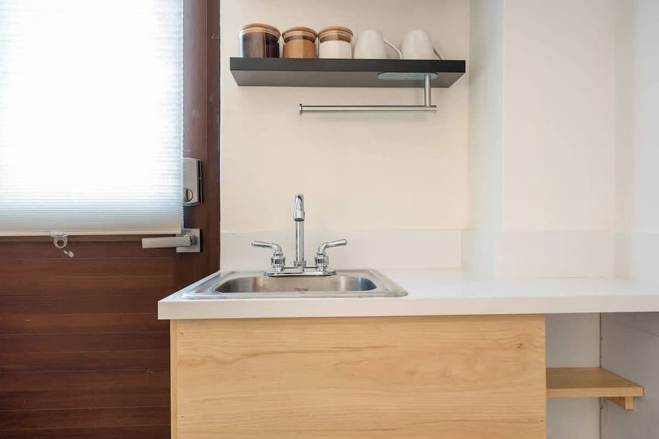 A compact kitchen area with a sink and plenty of counter space.