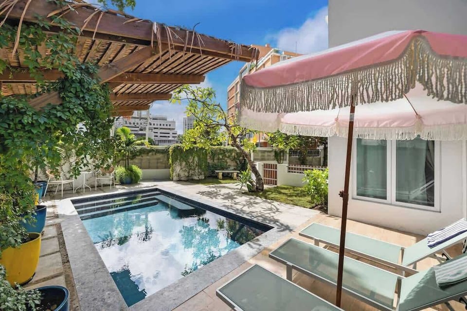 Relax under the parasol with a drink, and enjoy the sun.

