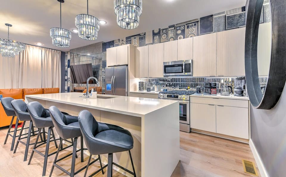 Pull up to the island to eat.  Additional seating with bar stools in the living room 

