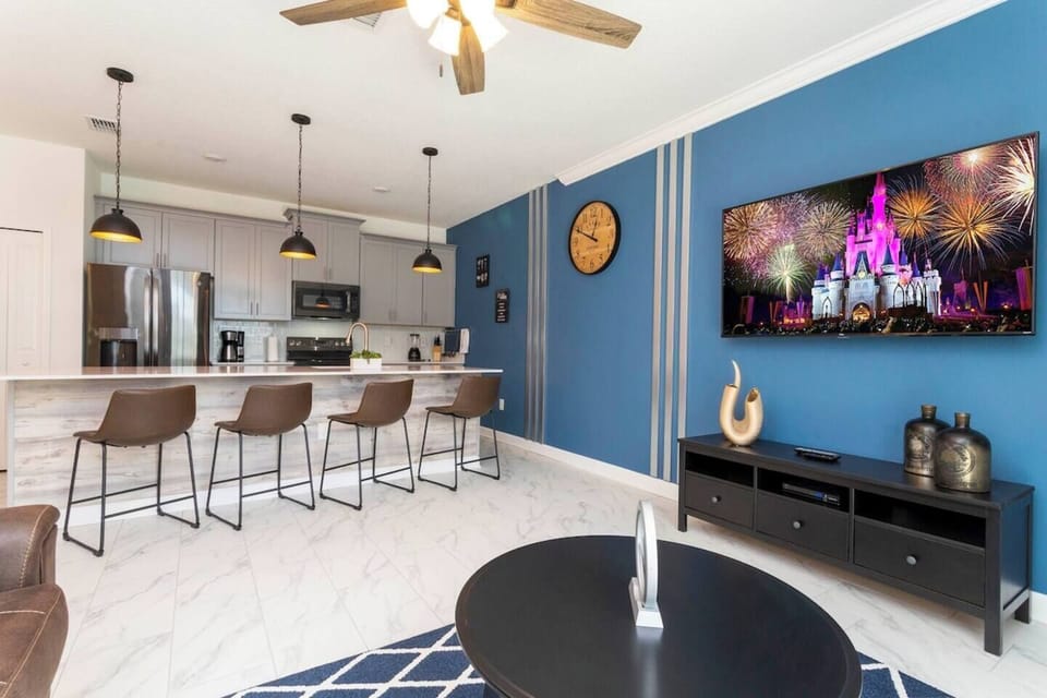 The fully equipped kitchen features modern appliances, sleek cabinetry, and all essential cookware and utensils, making it perfect for preparing meals with ease.