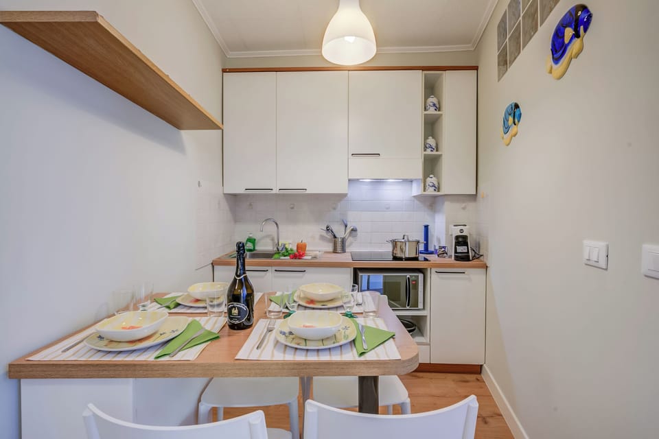 Standard Apartment, 1 Bedroom, Microwave (Armonia Centrale) | Private kitchen | Oven, coffee/tea maker