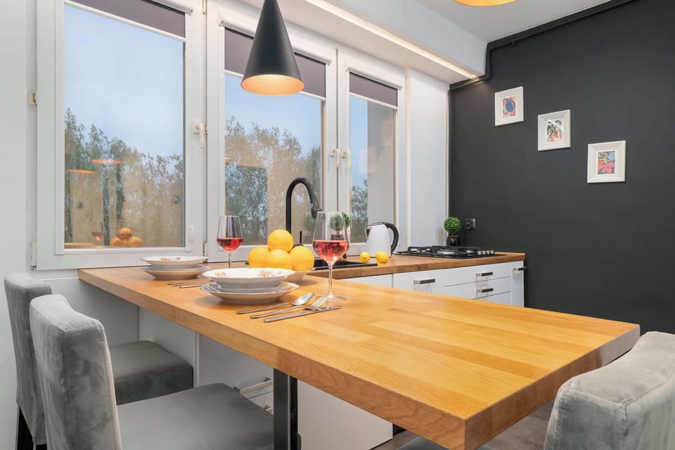 Large table with chairs for eating communal meals. 